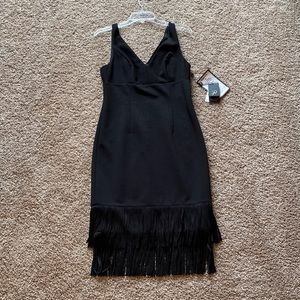 Sleeveless black dress with fringe